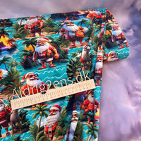 
              Bomulds jersey digital printet - julemanden er taget på ferie -  MULTI toner på TURKIS bund - GOTS
            